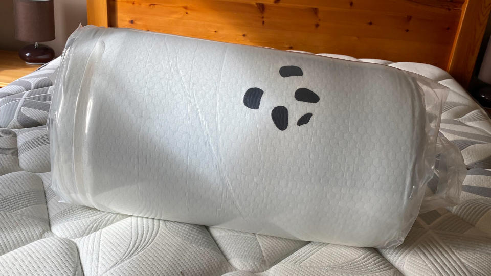 The Panda Bamboo Mattress Topper rolled and vacuum-packed