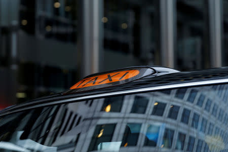 A taxi sign on top of an electric cab belonging to the London Electric Vehicle Company (LEVC) is seen in London, Britain, November 29, 2017. REUTERS/Darrin Zammit Lupi/Files