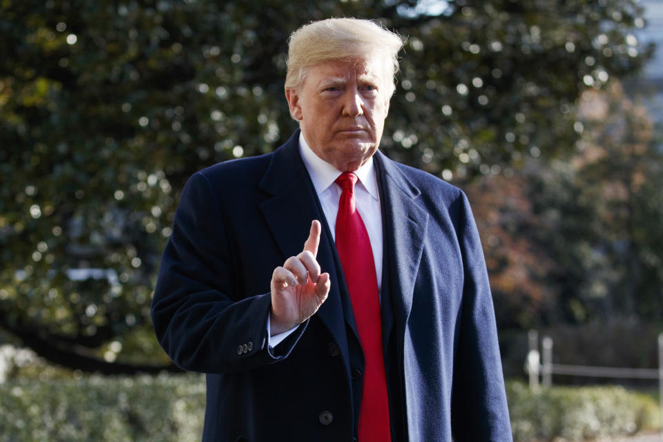 President Trump gestures to reporters on the South Lawn of the White House Friday. (Photo: Evan Vucci/AP)