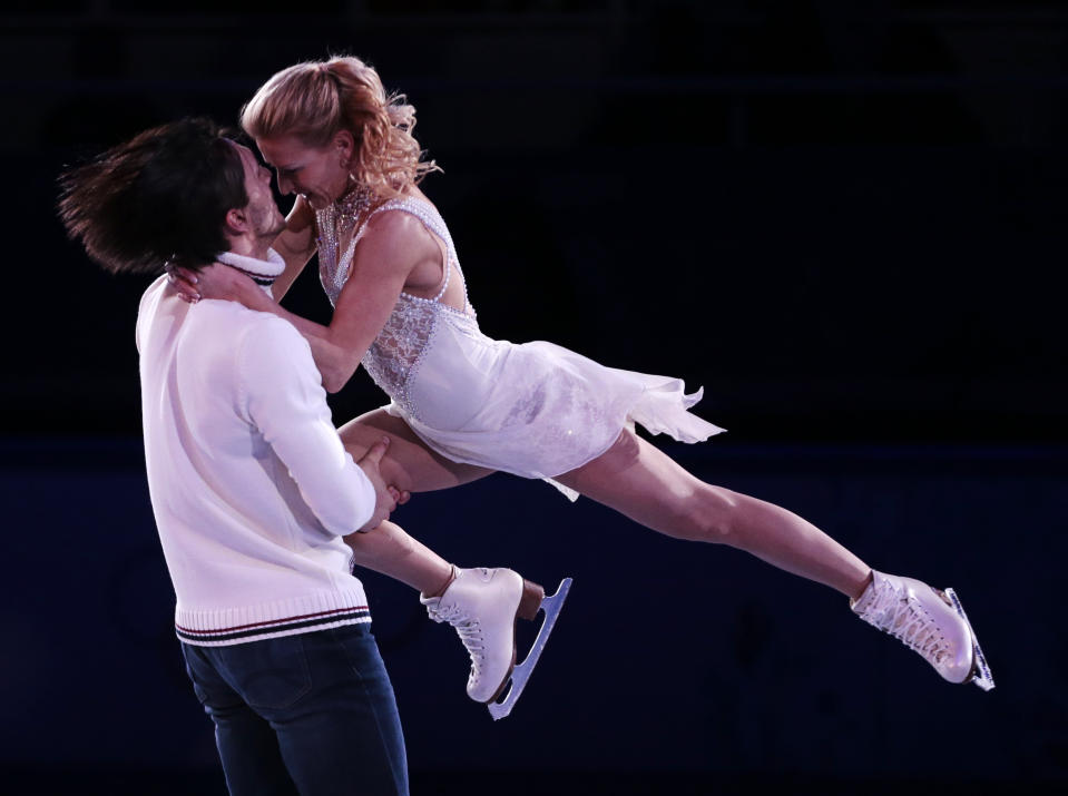 Tatiana Volosozhar and Maxim Trankov of Russia perform during the figure skating exhibition gala at the Iceberg Skating Palace during the 2014 Winter Olympics, Saturday, Feb. 22, 2014, in Sochi, Russia. (AP Photo/Ivan Sekretarev)