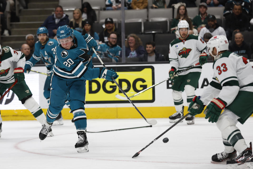 San Jose Sharks left wing Fabian Zetterlund (20) shoots against Minnesota Wild defenseman Alex Goligoski (33) during the first period of an NHL hockey game in San Jose, Calif., Saturday, March 11, 2023. (AP Photo/Josie Lepe)