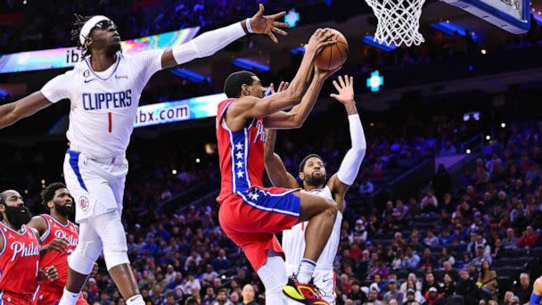 PHOTO: Philadelphia 76ers guard De'Anthony Melton (8) shoots against Los Angeles Clippers guard Reggie Jackson (1) and forward Paul George (13) in the first quarter at Wells Fargo Center. (Kyle Ross/USA TODAY Sports via Reuters)