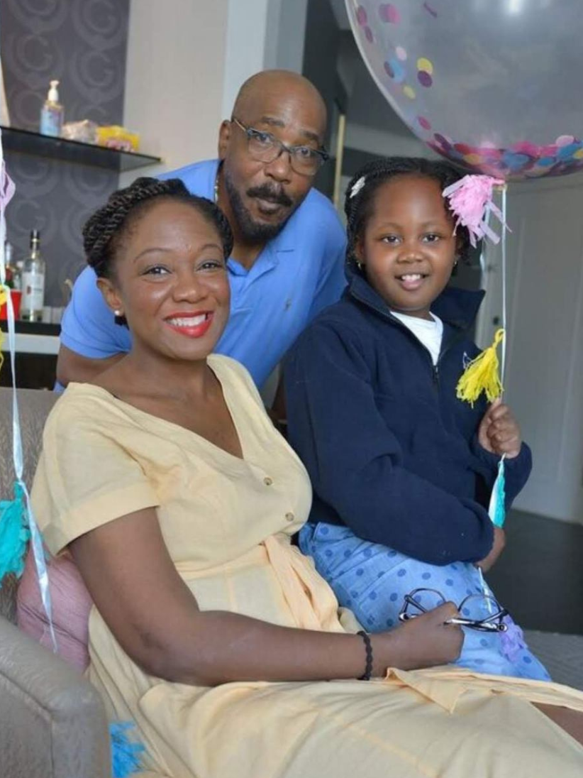 Kristal Higgins, a kidney transplant candidate, poses for a photo with her daughter and husband.