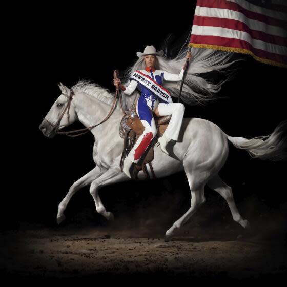 'Cowboy Carter' album art of Beyoncé in a red-white-and-blue rodeo outfit riding a horse and holding an American flag