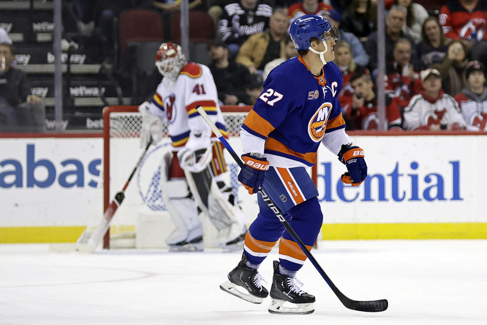 New York Islanders left wing Anders Lee (27) reacts after scoring a goal past New Jersey Devils goaltender Vitek Vanecek during the first period of an NHL hockey game Friday, Dec. 9, 2022, in Newark, N.J. (AP Photo/Adam Hunger)