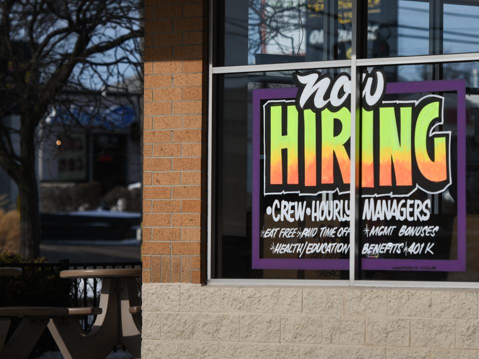 Signage seeking workers seen Tuesday, Jan. 11, 2022, at Taco Bell in Frandor.