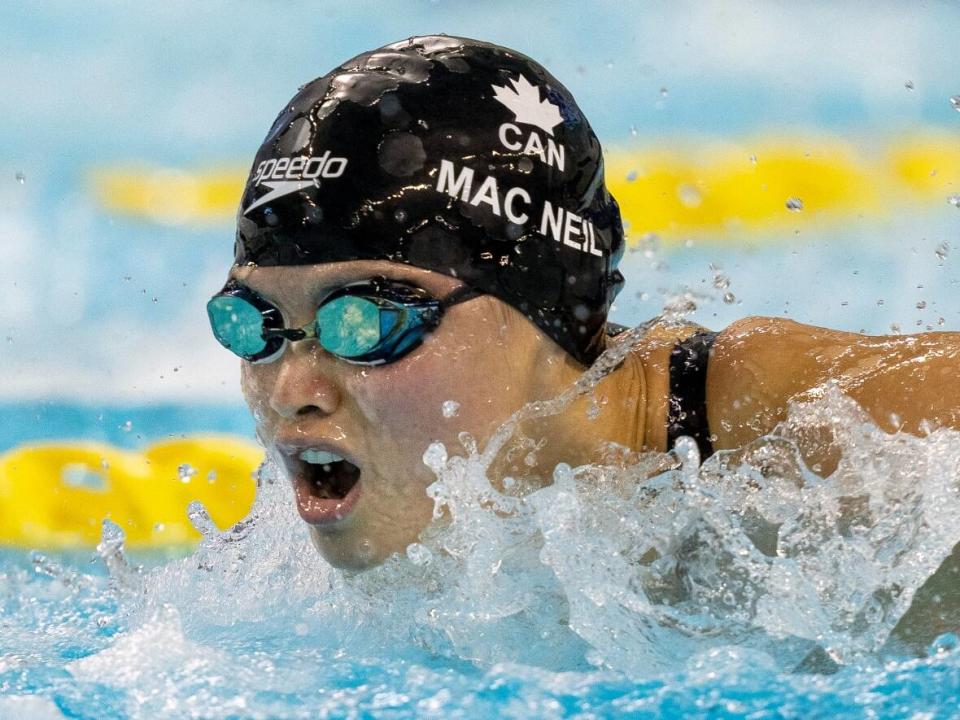 Canada's Maggie Mac Neil swims to victory in the women's 100-metre butterfly at the Canadian swimming trials in Toronto on March 29. (Frank Gunn/The Canadian Press - image credit)