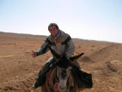 Getting a ride from one of the locals in Syria. (Caters News)
