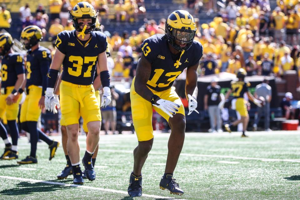 Michigan defensive back DJ Waller Jr. (13) warms up before the East Carolina game at Michigan Stadium in Ann Arbor, Saturday, Sept. 2, 2023.