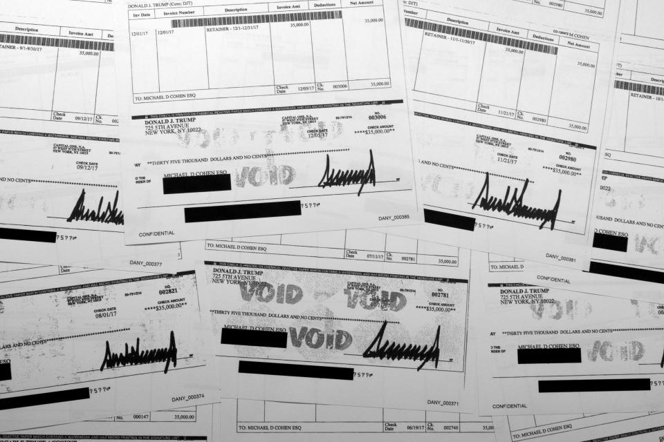 Alleged hush-money reimbursement checks signed by Donald Trump.
