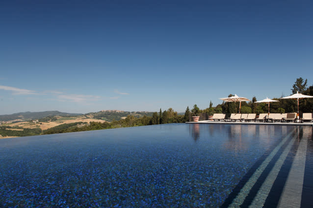 Castello di Casole, Tuscany. A gorgeous retreat dating back to the 10th century, Castello di Casole’s infinity pool sits high above the rolling Tuscan landscape. Did we mention it’s also heated? (www.castellodicasole.com)