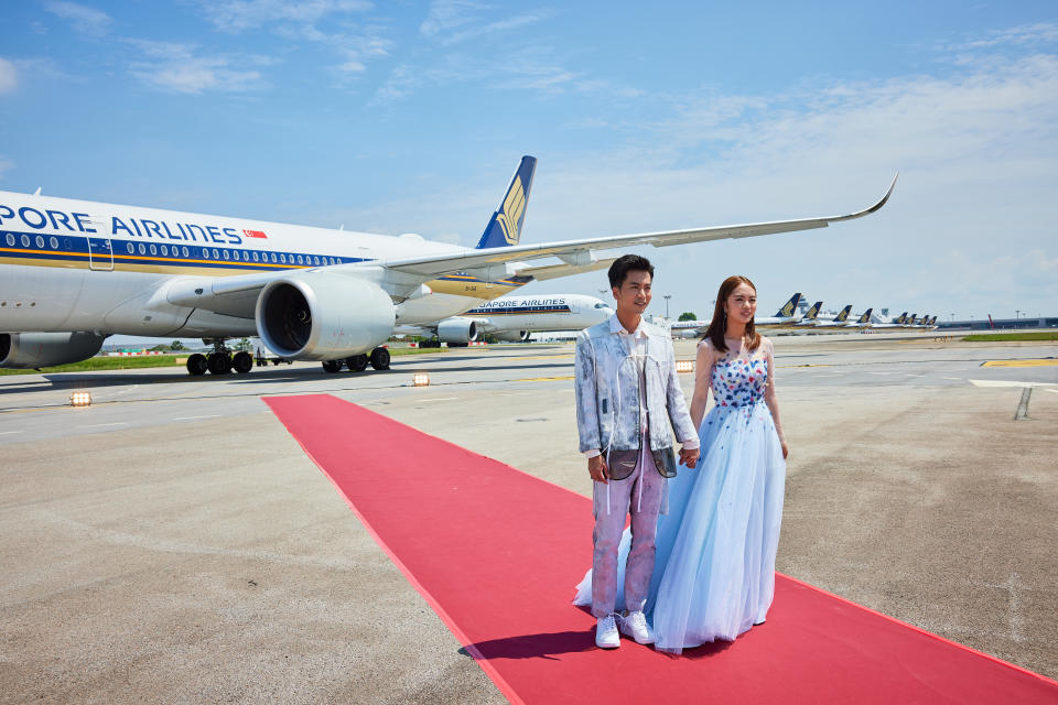 Xu Bin and his wife Evelyn Wang Yifei in a shoot prior to Star Awards held at Changi Airport on 18 April 2021. (Photo: Mediacorp)