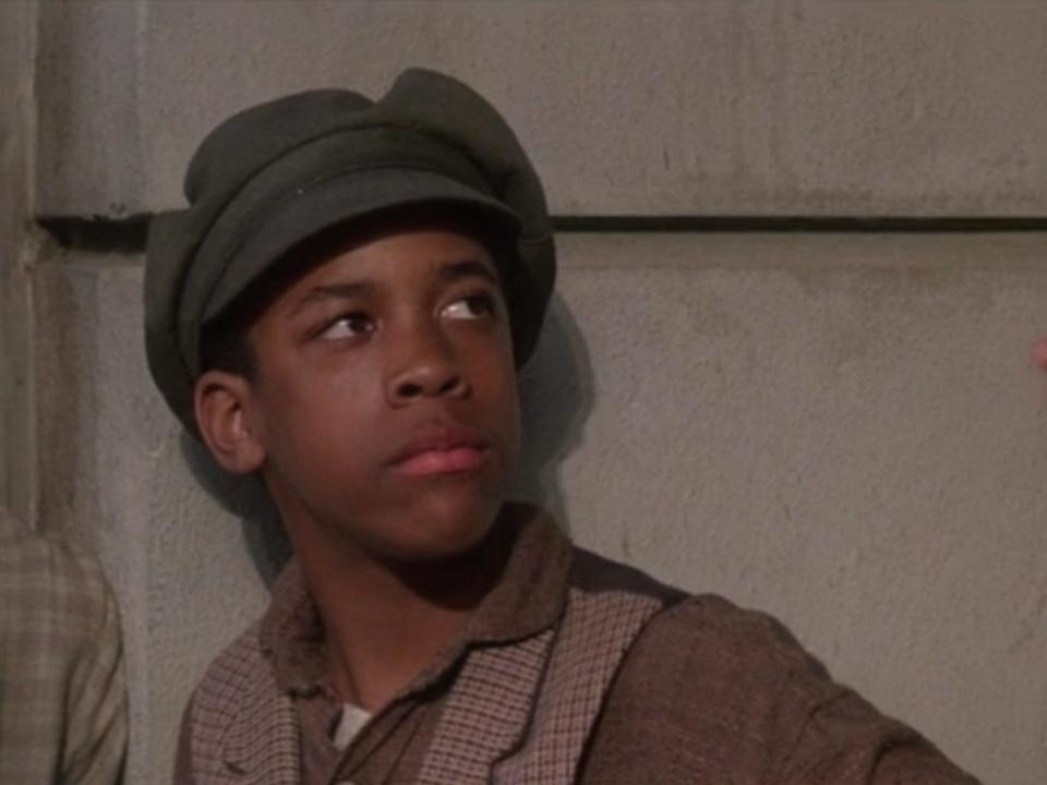 Boots (Arvie Lowe Jr) in newsies looking confused