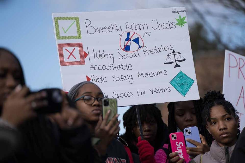 Students hold up signs against sexual assault at a protest at Delaware State University on Wednesday, Jan. 18, 2023.