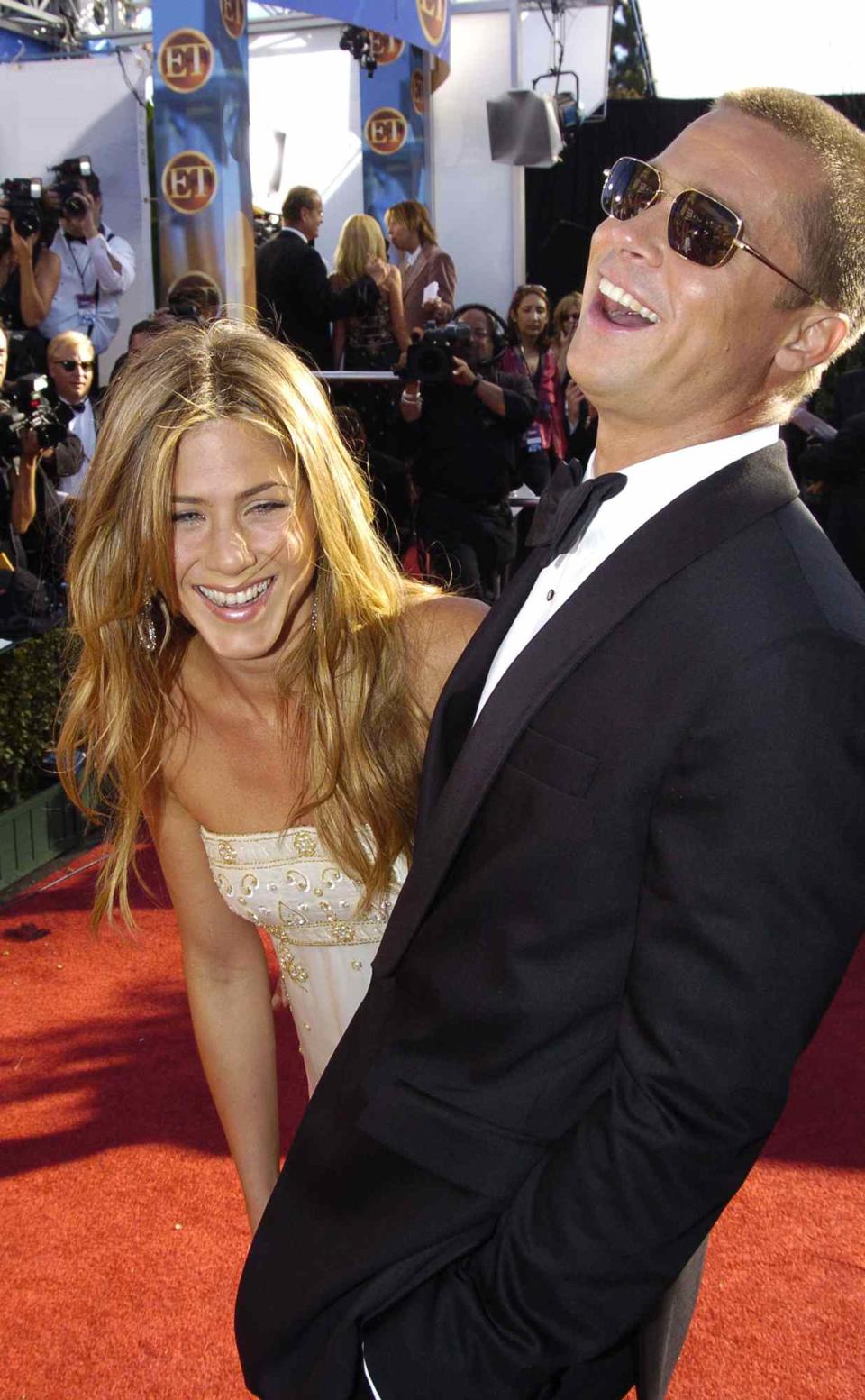 Jennifer Aniston and Brad Pitt during The 56th Annual Primetime Emmy Awards - Red Carpet at The Shrine Auditorium in Los Angeles, California, United States