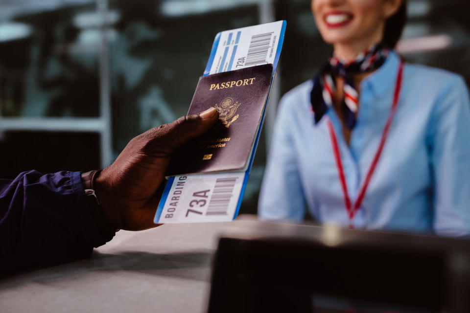 A traveler holding a passport