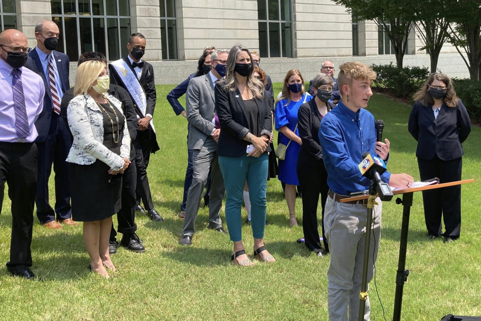 FILE - Dylan Brandt speaks at a news conference outside the federal courthouse in Little Rock, Ark., July 21, 2021. Brandt, a teenager, is among several transgender youth and families who are plaintiffs challenging a state law banning gender confirming care for trans minors. A nonprofit that launched last year to oppose diversity initiatives in medicine, has evolved into a significant leader in statehouses to ban gender-affirming care for transgender youths, producing model legislation that an Associated Press analysis found has been used in at least three states. (AP Photo/Andrew DeMillo, File)