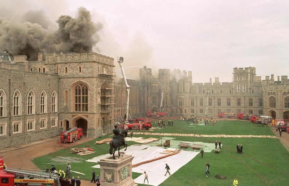 Firefighters battle a huge blaze at Windsor Castle, a royal residence 30 miles (48 kilometres) west of London, 20 November 1992. The blaze, that reportedly started in the private St. George's Chapel, caused extensive damage. Queen Elizabeth II's youngest son Edward will marry his fiancee Sophie Rhys-Jones 19 June 1999 in St. George's chapel.