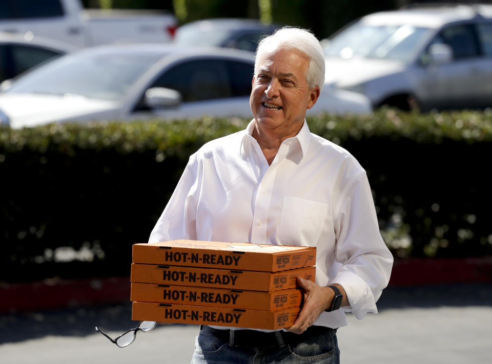 FILE - In this Nov. 6, 2018, file photo, Republican gubernatorial candidate John Cox brings lunch to the offices of Rep. Mimi Walters, R-Calif., in Irvine, Calif. Cox and Caitlyn Jenner, two Republicans running to oust California Gov. Gavin Newsom, sought to make a fresh impression with voters Tuesday, May 4, 2021, with the release of new campaign ads, marking a new phase in the pending recall. (AP Photo/Chris Carlson, File)