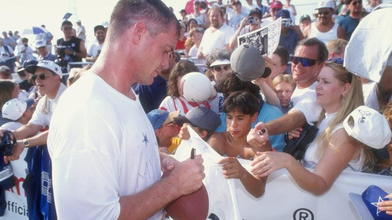 Fullback Daryl Johnston of the Dallas Cowboys signing autographs during the 1998 Dallas Cowboys Training Camp at Midwestern State University in Wichita Falls, Texas