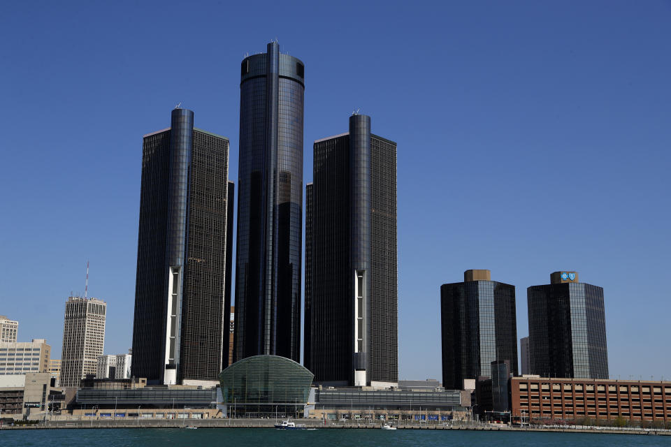 This May 12, 2020, photo shows a general view of the Renaissance Center, headquarters for General Motors, along the Detroit skyline from the Detroit River. A federal judge in Detroit dismissed General Motors’ lawsuit Wednesday, July 8, 2020, alleging that rival Fiat Chrysler paid off union leaders to get better contract terms than GM. (AP Photo/Paul Sancya)