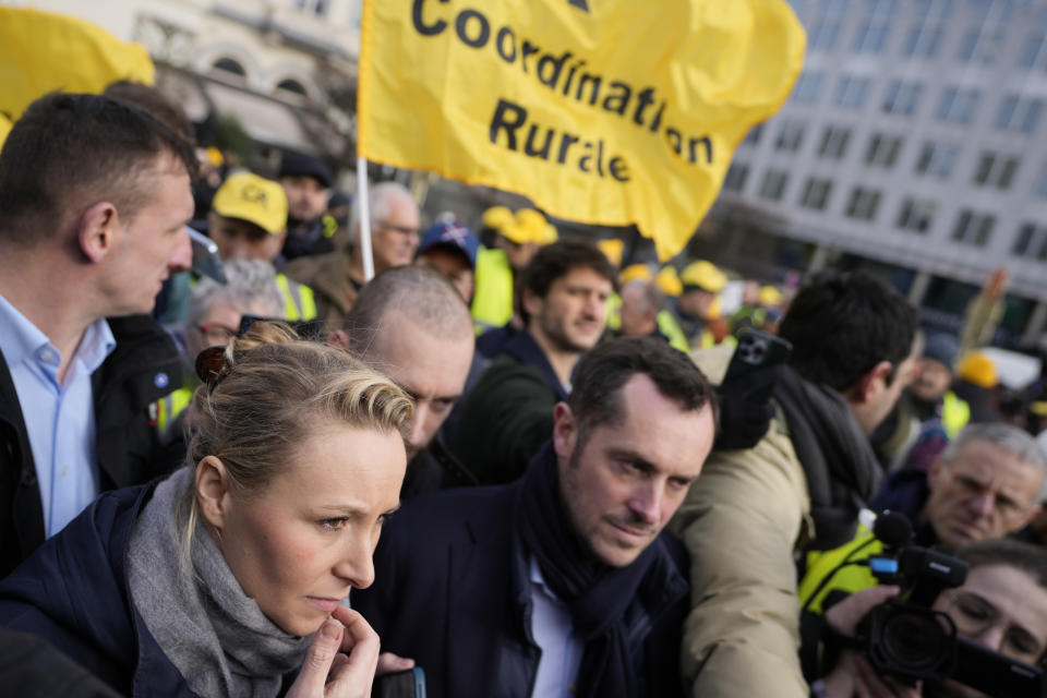 Marion Marechal, Marine Le Pen's niece and Executive Vice President of French far-right party 'Reconquete', front left, joins a demonstration of French and Belgian farmers outside the European Parliament in Brussels, Wednesday, Jan. 24, 2024. (AP Photo/Virginia Mayo)