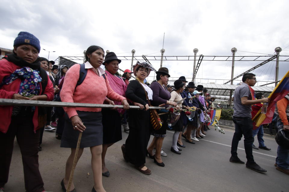 Indigenous anti-government demonstrators march against President Lenin Moreno and his economic policies during a nationwide strike, in Quito, Ecuador, Wednesday, Oct. 9, 2019. Ecuador's military has warned people who plan to participate in a national strike over fuel price hikes to avoid acts of violence. The military says it will enforce the law during the planned strike Wednesday, following days of unrest that led President Lenín Moreno to move government operations from Quito to the port of Guayaquil. (AP Photo/Carlos Noriega )