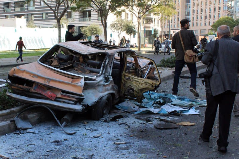 Officials gather at the site of an explosion in downtown Beirut that killed seven people, including former Lebanese Minister Mohamad Chatah, on December 27, 2013. File Photo by Mohamad Sultan/UPI