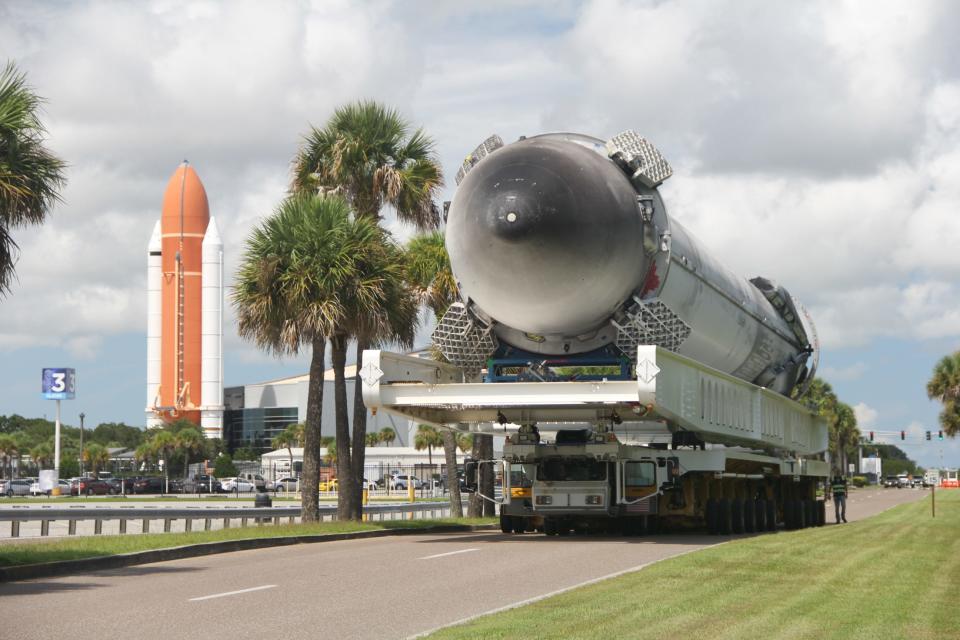 A Falcon Heavy side booster – identical to Falcon 9 boosters flown for other missions – is delivered to the Kennedy Space Center Visitor Complex on Tuesday, Sept. 14, 2021. It will be displayed horizontally in a new attraction called "Gateway."
