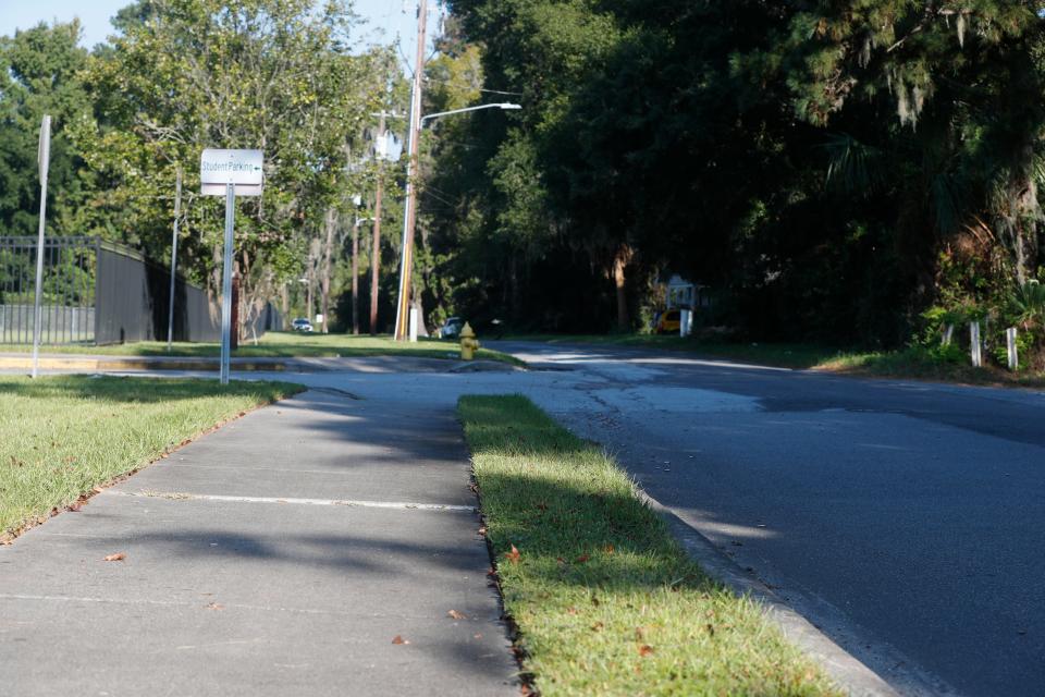 The sidewalk behind Johnson High runs along Shell Road, but ends before the residential area begins.