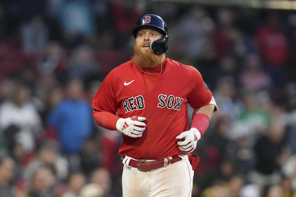 Boston Red Sox's Justin Turner returns to the dugout his two-run home run against the Seattle Mariners during the second inning of a baseball game Wednesday, May 17, 2023, in Boston. (AP Photo/Steven Senne)