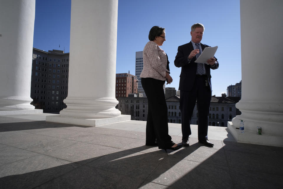 FILE - In this March 7, 2020 file photo, Sen. Jennifer McClellan, D-Richmond, left, and Del. Tony Wilt, R-Rockingham, right, sign a conference committee report on the South Portico of the Virginia State Capitol in Richmond, Va., McClellan announced Thursday, June 18 that she is launching a bid to be the state's next governor, which if successful would make her the nation's first ever African-American woman to ever lead a state. (Bob Brown/Richmond Times-Dispatch via AP, File)