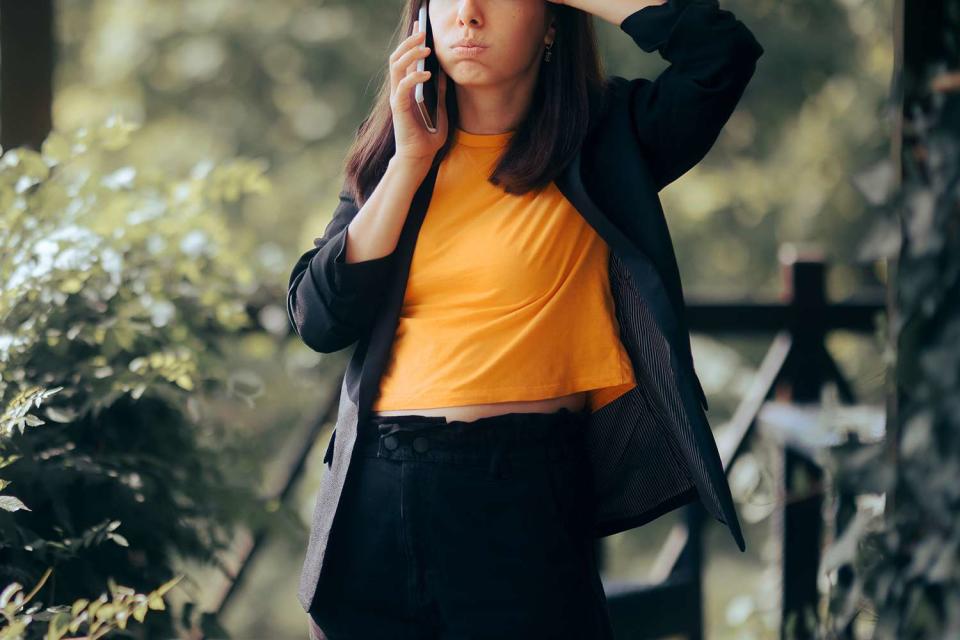 <p>Getty</p> A woman on a phone (stock image)