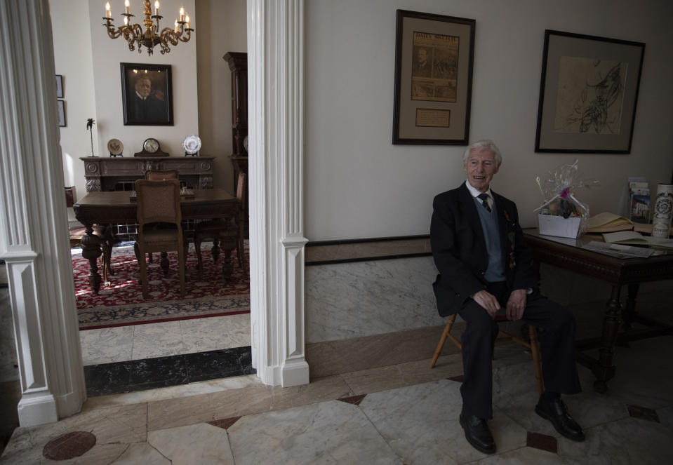 British RAF veteran George Sutherland, 98, poses for a photo at Talbot House after taking part in a VE Day charity walk to raise funds for the club in Poperinge, Belgium, Friday, May 8, 2020. Sutherland walked from the Lijssenthoek war cemetery to Talbot house to raise money for the club which is currently closed due to coronavirus lockdown regulations. The club, founded in 1915 was a place for British soldiers to rest during both the First and Second World Wars. (AP Photo/Virginia Mayo)