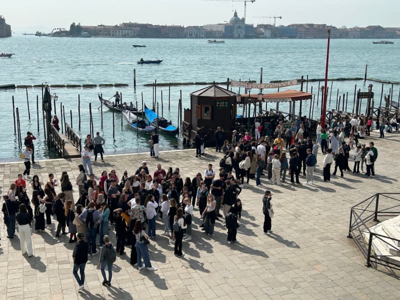 "All we have from them is their rubbish," says one Venice gondolier of day-tripping tourists who bring backpacks with food and leave before spending money. Christoph Sator/dpa