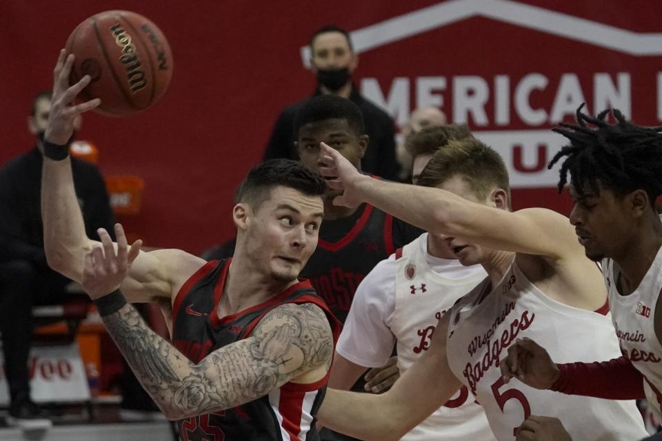 Ohio State's Kyle Young saves the ball from going out of bounds during the second half of an NCAA college basketball game against WisconsinSaturday, Jan. 23, 2021, in Madison, Wis. (AP Photo/Morry Gash)