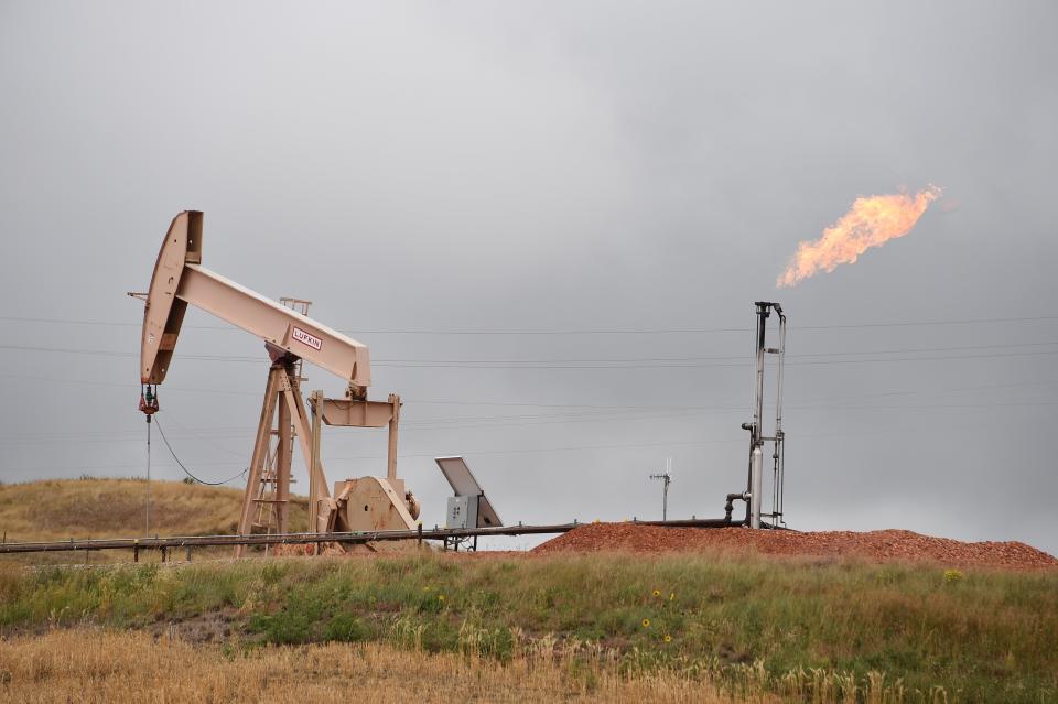 Fossil fuel companies are exacerbating the climate crisis if they keep drilling for new oil activists say. (Photo: ROBYN BECK via Getty Images)