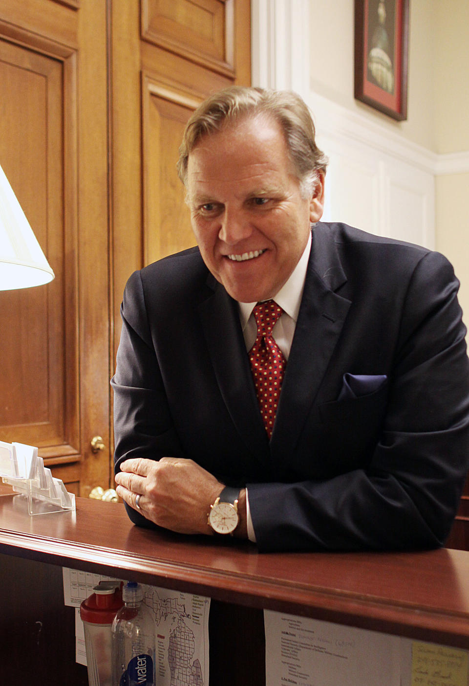 In this April 30, 2014 photo, Rep. Mike Rogers, R-Mich, smiles in his office on Capitol Hill in Washington, Wednesday, April 30, 2014. The daily radio show Rogers begins hosting in January will give the Michigan Republican practice talking to millions of Americans every day, and honing what he calls a “productive conservative” message talk radio is desperately lacking, he said. (AP Photo/Lauren Victoria Burke)