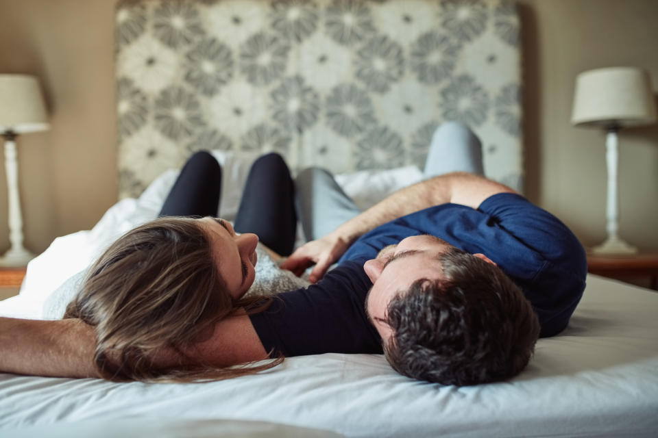 Shot of a happy young couple sharing a romantic moment in the bedroom at home