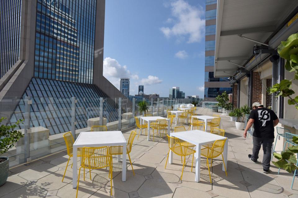 The outdoor rooftop dining area of Estrella Cocina, part of the Bread & Board complex in the VyStar Building Wednesday morning, August 18, 2021. The Bread & Board and Provisions restaurant and store on the ground floor of VyStar building at the corner of Laura and West Bay Streets readies for it's opening.