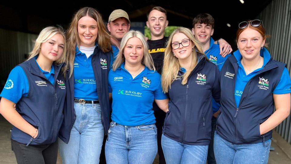 Young farmers huddled in a group