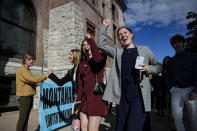 FILE - Youth plaintiffs in the climate change lawsuit, Held vs. Montana, arrive at the Lewis and Clark County Courthouse, June 20, 2023, in Helena, Mont., for the final day of the trial. A Montana judge in August 2023 sided with young environmental activists who said state agencies were violating their constitutional right to a clean and healthful environment by permitting fossil fuel development without considering its effect on the climate. The state's effort to overturn the ruling is now before the Montana Supreme Court. (Thom Bridge/Independent Record via AP, File)/Independent Record via AP)