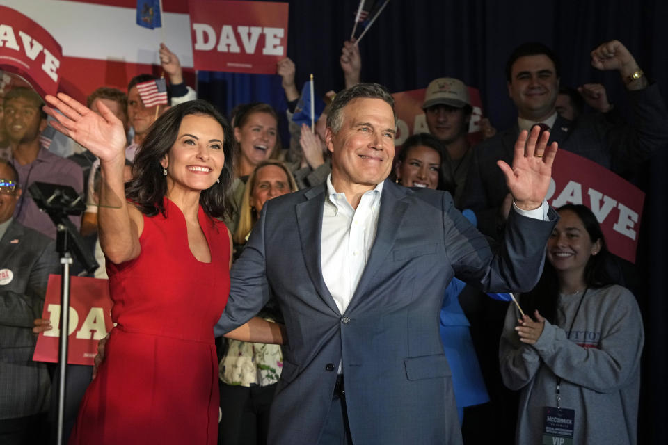 Republican David McCormick, right, is joined by his wife Dina Powell, left, as he arrives at the Heinz History Center to announce that he will enter Pennsylvania's U.S. Senate race and make his second bid for the office, this time to take on Democratic Sen. Bob Casey, Thursday, Sept. 21, 2023, in Pittsburgh. (AP Photo/Gene J. Puskar)