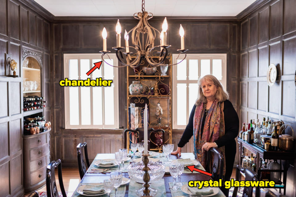 A woman standing in her dining room