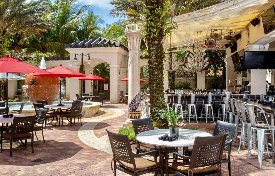 The patio space at the former Burger Bar location offers plenty of room for al fresco seating and features an outdoor bar and circular fountain.