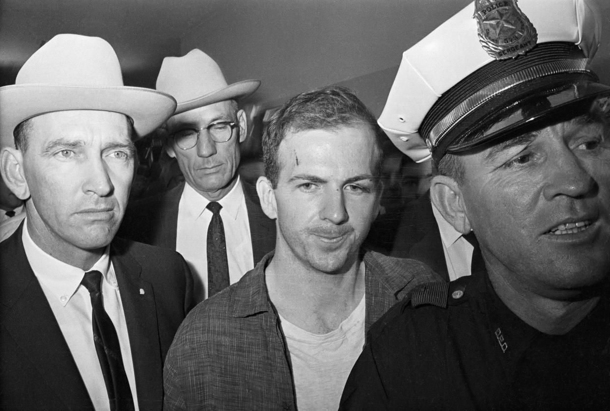 Lee Harvey Oswald, 24, an ex-Marine, is shown after his arrest Nov. 22, 1963, in Dallas. He received a cut on his forehead and blackened left eye in a scuffle with Dallas police officers who arrested him. Oswald, an avowed Marxist, was charged with the murder of President John F. Kennedy Jr., who was killed hours earlier by a sniper's bullet as he rode in motorcade through Dallas.