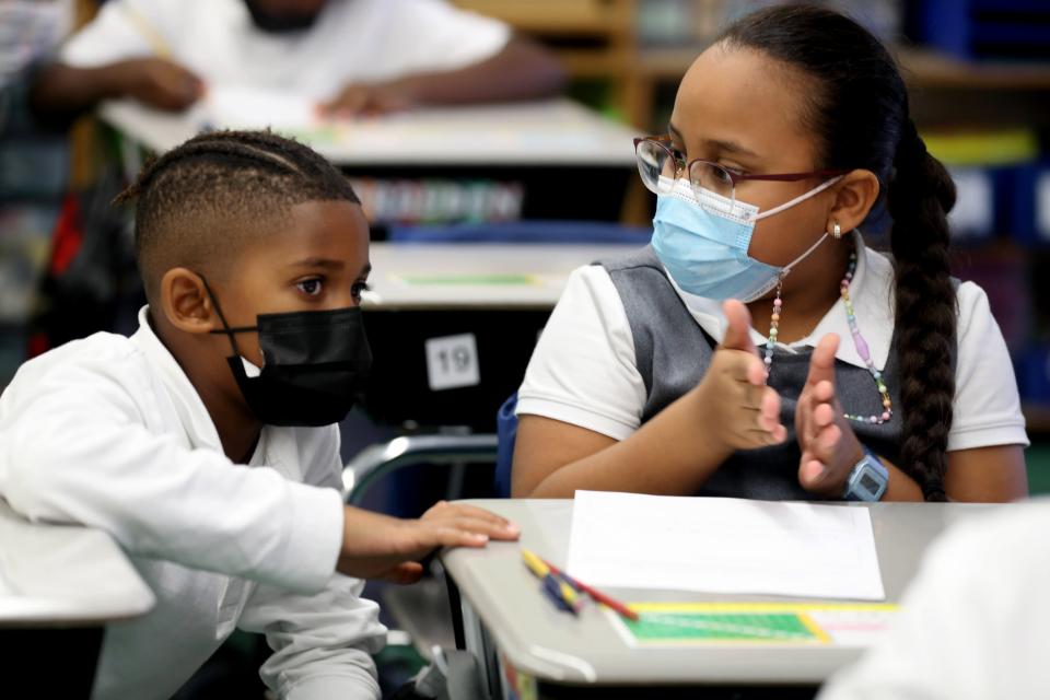 Aiden Ellis and Jeslyn Gonzalez, fourth-grade students at Leadership Prep Canarsie, a charter school in Brooklyn, N.Y., work together during the ninety minute math component of the school day Oct. 28, 2021. 