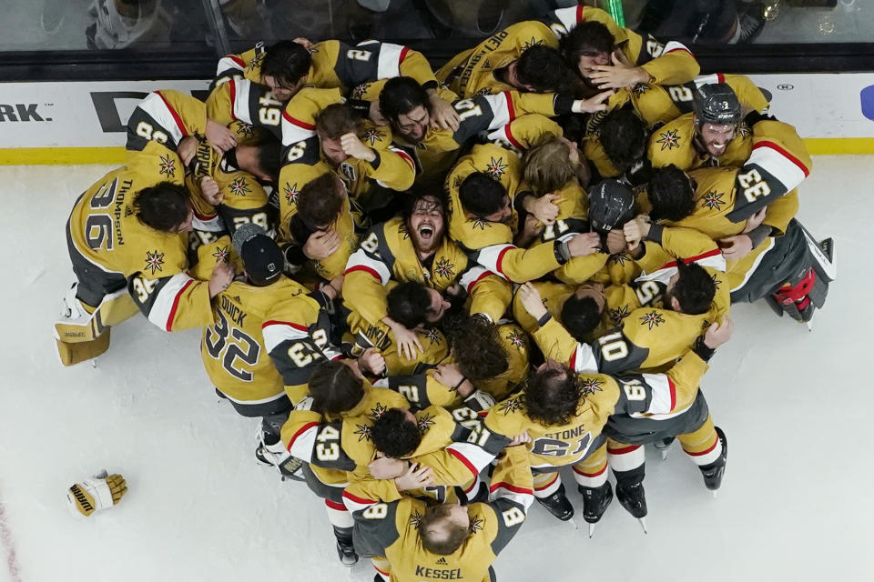 Vegas Golden Knights players celebrate after defeating the Florida Panthers to win the Stanley Cup in Game 5 of the NHL hockey Stanley Cup Finals, Tuesday, June 13, 2023, in Las Vegas. (AP Photo/Abbie Parr)