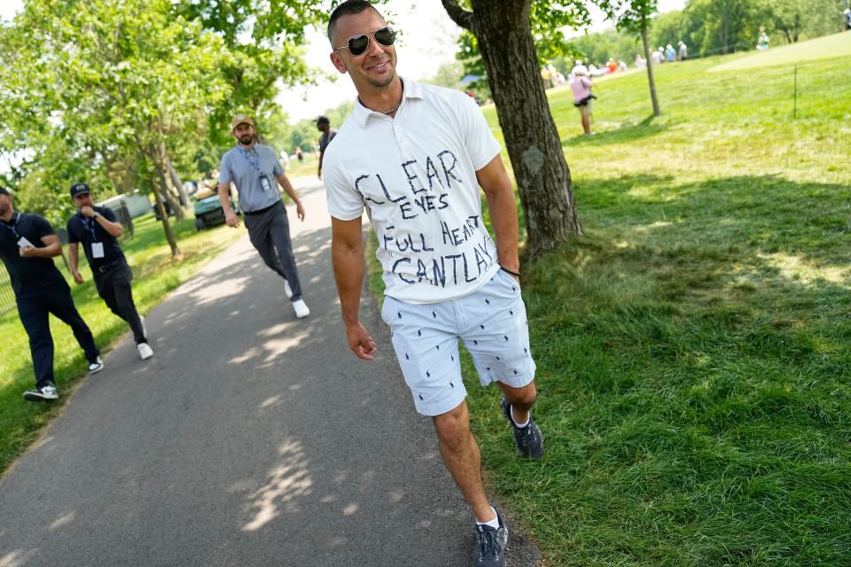 June 3, 2023; Dublin, Ohio, USA;  Joe Bokros of Youngstown wears a hand-drawn “clear eyes full hearts Cantlay” polo shirt as he following Patrick Cantlay during the third round of the Memorial Tournament at Muirfield Village Golf Club. 