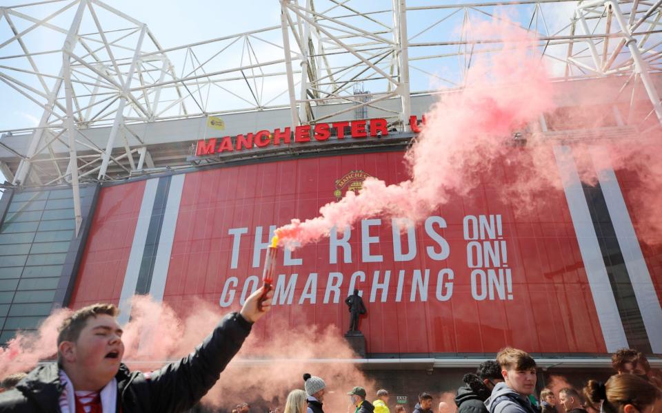 Manchester United fans protest against their owners before the Manchester United v Liverpool  - Reuters